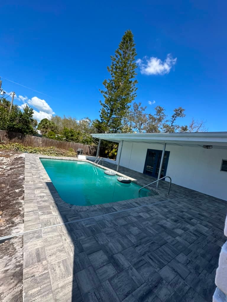 Herringbone paver pool deck at a Clearwater home