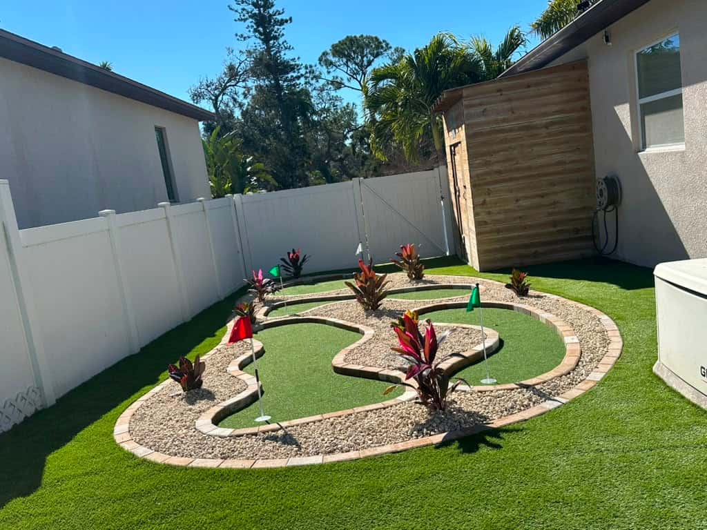 Landscaped artificial-turf backyard in the Tampa Bay area