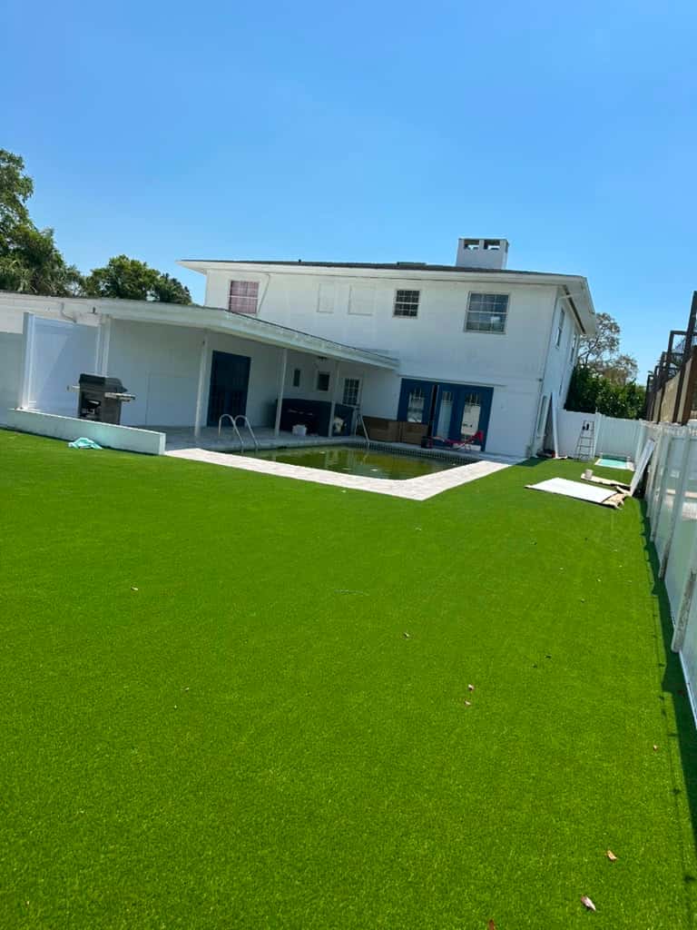 Even artificial-turf lawn behind a modern Odessa home