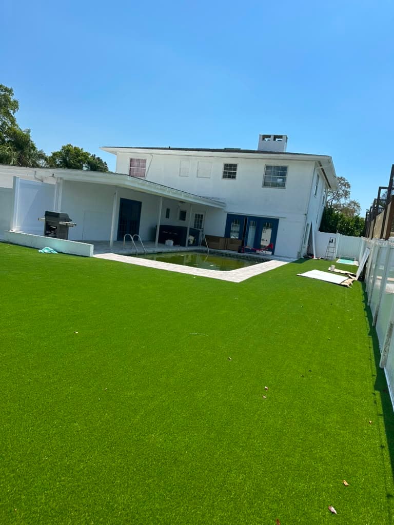 Even artificial-turf lawn behind a modern Odessa home
